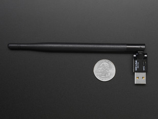 USB WiFi (802.11b/g/n) Module with Antenna for Raspberry Pi above a US quarter for scale. 