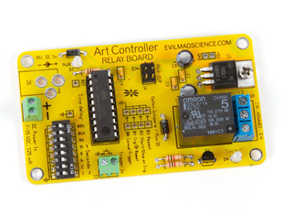 Assembled credit card sized yellow PCB with ART CONTROLLER silkscreen.