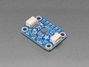 Angled shot of a blue rectangular ADC breakout board.