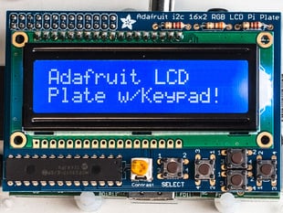 Top down view of a Adafruit Blue&White 16x2 LCD+Keypad Kit for Raspberry Pi. Display reads "Adafruit LCD Plate w/Keypad!"