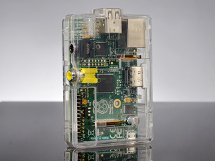 Angled shot of assembled clear Raspberry Pi Model A or B standing up.