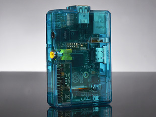 Angled shot of assembled blue acrylic Raspberry Pi model A or B case with Pi computer installed. The enclosure stands up.