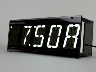 Angled shot of nightstand clock with large white digits
