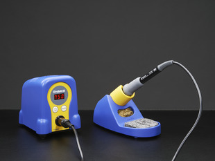 Two piece adjustable soldering iron with blobby temperature adjustable body and separate fancy holder