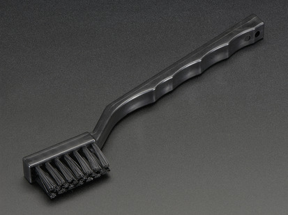 Black toothbrush-looking brush