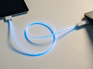 Lit up USB cable between computer and iPhone - White w/Aqua. 
