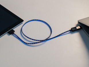 Lit up USB cable between computer and iPhone - Black w/Aqua.