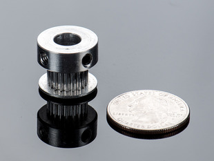 Aluminum Timing Pulley next to quarter