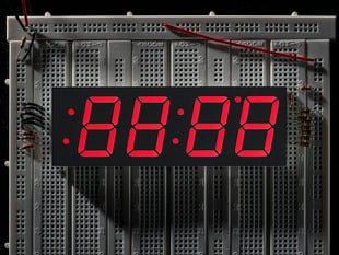 Huge red 7-segment clock display with all segments lit