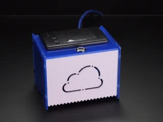 Square acrylic box with cloud sign on front, with receipt paper coming out with text on it.