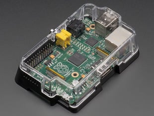Angled shot of assembled assembled clear Pi Case for Raspberry Pi Model A or B. A Pi computer is installed in the case.
