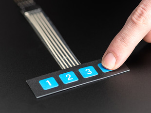 Finger pressing a button of 1x4 flexible  keypad