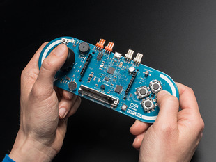 Hands holding Arduino Esplora like a game controller