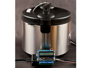 Large cylindrical hot pot with Arduino in front with LCD screen displaying "Sous Vide"