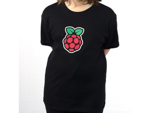 Child wearing black t-shirt with Raspberry Pi logo