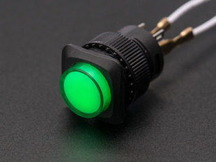 Angled shot of a green 16mm illuminated pushbutton. 