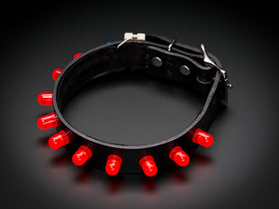 Leather collar with gumdrop-shaped red LEDs sticking out instead of spikes.