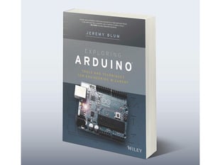 Angled shot of front cover of "Exploring Arduino Tools and Techniques for Engineer Wizardry" by Jeremy Blum.
