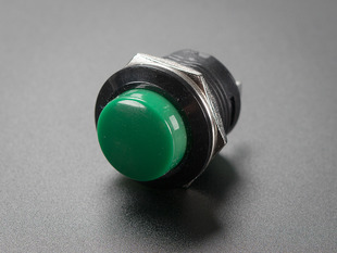 Angled shot of 16mm green panel mount pushbutton.