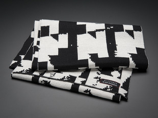 Folded black and white scarf with glitch design