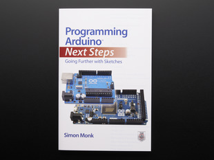 Front cover of "Programming Arduino: Next Steps - Going Further with Sketches" by Simon Monk. Cover features two blue rectangular microcontrollers, the Arduino Uno and Arduino Due.