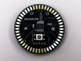 Angled shot of a black circular PCB ringed with white LEDs. 