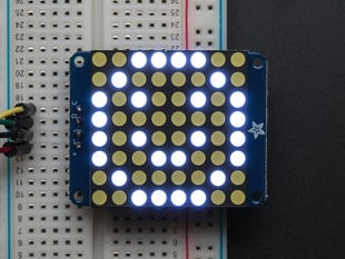 Assembled and powered on Small 1.2" 8x8 Ultra Bright White LED Matrix. A white graphical smiley is displayed.