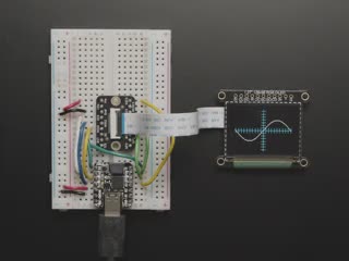 Overhead video of OLED breakout displaying triple axis numbers.