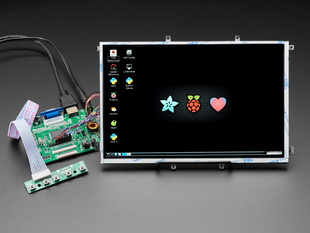 Angled shot of an assembled 10.1" Display & Audio 1280x800 IPS - HDMI/VGA/NTSC/PAL. The HDMI screen displays a desktop image including the Adafruit logo, the Raspberry Pi logo, and a pink heart.