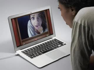 This shows small clips of a woman in front of her laptop covering the camera part of the laptop with a small eye image sticker.