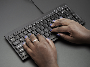 Mini Chiclet Keyboard - USB Wire. Black colored, in use