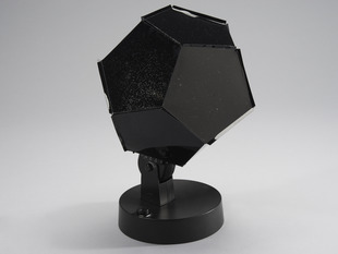 Black dodecahedron siting on a stand