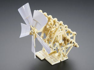 Angled shot of assembled biped mini kinetic sculpture kit.