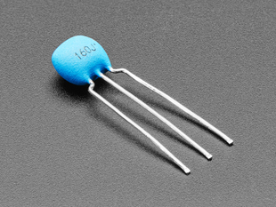 Angled shot of blue ceramic resonator / oscillator