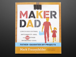 Front cover of "Maker Dad" by Mark Frauenfelder. "Lunch box guitars, antigravity jars, and 22 other incredibly cool father-daughter DIY projects. Cover illustration is of a feature-less father and daughter cartoons.