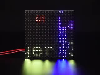 LED matrix with colorful text scrolling by in mulitple directions and speeds