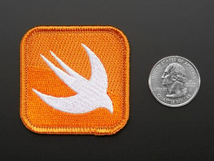 Square shaped embroidered badge of the stylized bird Swift logo in white on orange background. 