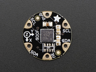 Top down view of a FLORA 9-DOF Accelerometer/Gyroscope/Magnetometer.