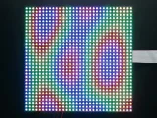 Video of assembled and powered on 32x32 RGB LED Matrix Panel - 5mm pitch. The matrix displays swirling, psychedelic rainbow colors.