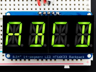 Assembled Quad Alphanumeric Display with yellow-green display showing "ABCD"