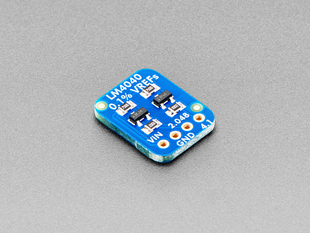 Angled shot of small, blue, rectangular voltage breakout board.