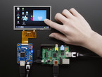 Breakout connected to TFT and Raspberry Pi, showing Pi desktop screen. Hand is dragging a selection with the touchscreen.