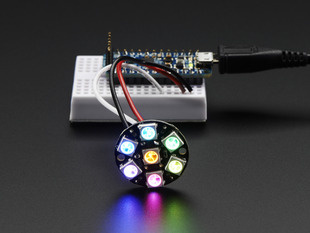 NeoPixel Jewel - 7 x 5050 RGB LED wired to Trinket, lit up rainbow