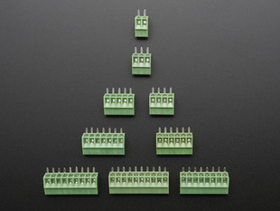 Top view of a pyramid of green terminal blocks of various sizes.