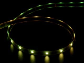 Video of part of a coiled LED strip glowing rainbow colors in succession.