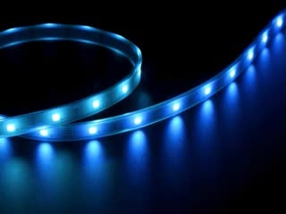 Video of part of a coiled LED strip glowing rainbow colors in succession.