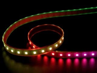 Video of part of a coiled LED strip glowing various colors in succession.
