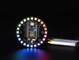 Adafruit Particle/Spark NeoPixel Ring Kit connected to a battery. 