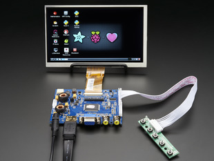 Front shot of a HDMI 4 Pi: 7" Display. The monitor displays a desktop background with a adafruit logo, raspberry logo, and a heart. 