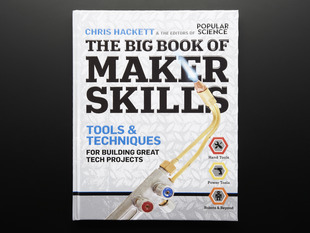Front cover of The Big Book of Maker Skills by Chris Hackett & the editors of Popular Science. Tools & techniques for building great tech projects. Closeup of a blow torch powered on with a blue flame.